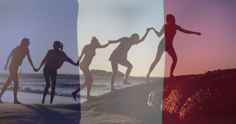 French flag overlay on diverse friends beach gathering