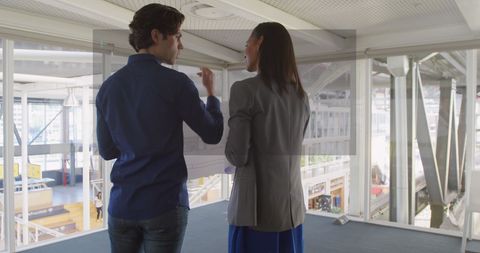 Professionals Discussing Project in Modern Office