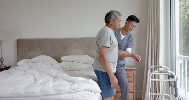 Caregiver assisting elderly man with walker in bedroom - Download Free Stock Images Pikwizard.com