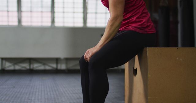 Female Athlete Resting on Box in Gym - Download Free Stock Images Pikwizard.com