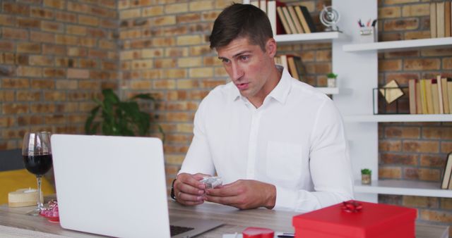 Man Learning to Tie a Bow Tie Online in Home Office - Download Free Stock Images Pikwizard.com