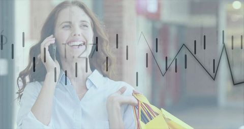 Joyful Shopper Using Smartphone Holding Colorful Shopping Bags