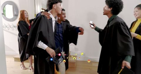Graduates greeting and celebrating with mortarboards, smartphone reactions and casual reunion