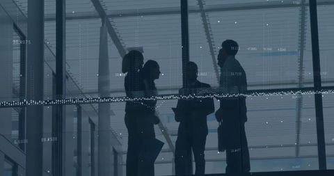 Silhouetted Business Team with Digital Data Overlay in Corporate Setting