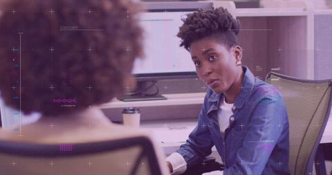 Business professional engaging in collaborative office discussion