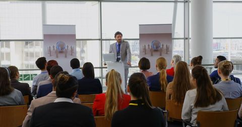 Businessman Delivering Keynote Address at Corporate Conference