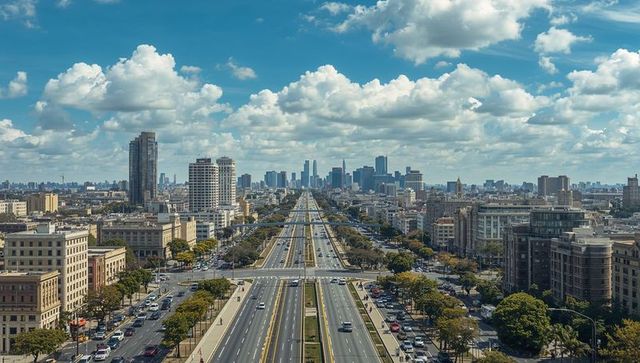 Expansive Multi-Lane Boulevard Leading Toward Downtown Skyline Under Dynamic Cloudscape