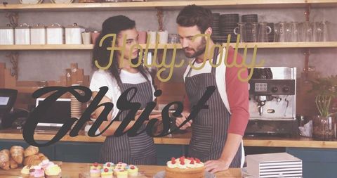 Cafe Team Reviewing Digital Orders with Holiday Decoration