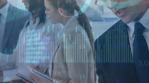 Colleagues Analyzing Financial Data at a Business Meeting