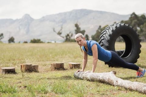 Woman Performing Outdoor Plank Exercise on Log in Natural Setting - Download Free Stock Images Pikwizard.com