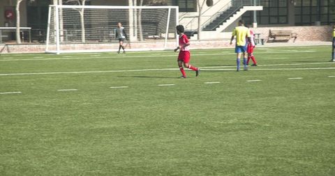 Youth Soccer Players Engaged in Vibrant Match