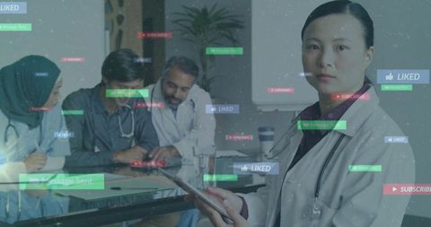 Doctor Holding Tablet with Digital Icons in Hospital Environment