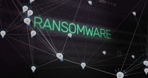 Glowing ransomware text over connected lightbulb nodes, network threat visualization
