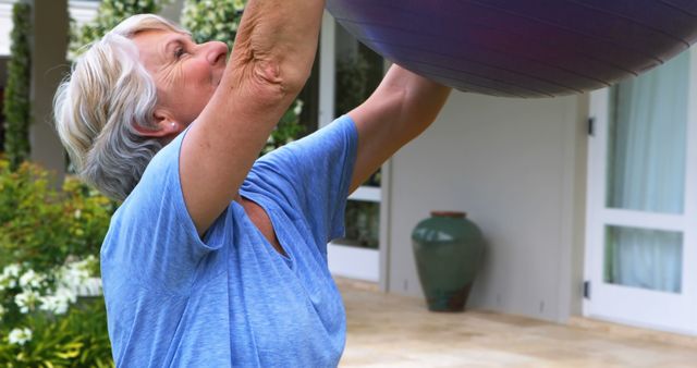 Senior Woman Exercising Outdoors with Stability Ball - Download Free Stock Images Pikwizard.com