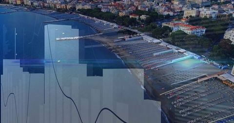 Coastal Town Overview with Beach Loungers and Umbrellas