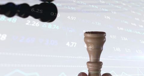 Strategic thinking concept with chess piece and stock market data