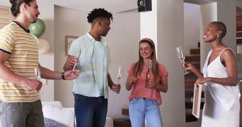Friends Enjoying Casual Celebration with Champagne Glasses