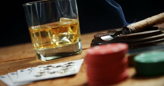 Glass of Whiskey, Poker Chips, Playing Cards and Cigar in a Smoky Environment - Download Free Stock Images Pikwizard.com