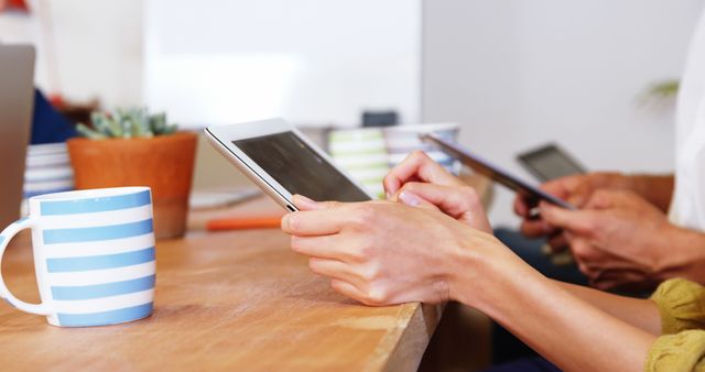 Close-Up of Hands Using Digital Tablets at Work Desk - Download Free Stock Images Pikwizard.com