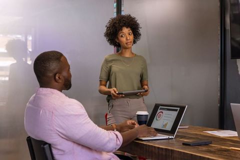 Coworkers Meeting in Modern Conference Room Discussing Business Strategy