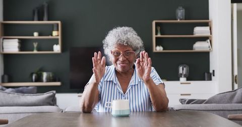 Joyful Senior African American Woman on Video Call at Home