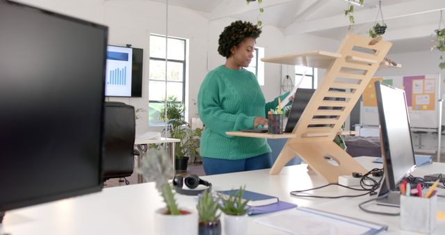 Focused Professional Working at Standing Desk in Modern Office - Download Free Stock Images Pikwizard.com