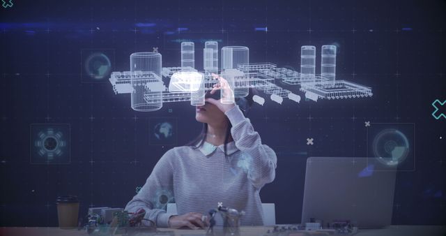 A woman is using a VR headset to interact with augmented reality designs. The background features a holographic blueprint of industrial structures, indicating a high-tech environment. This would be useful for articles or ads focusing on innovation, VR technology, digital design, or the future of professional industry tools.