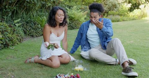 Couple Enjoying Romantic Picnic in Garden Landscape