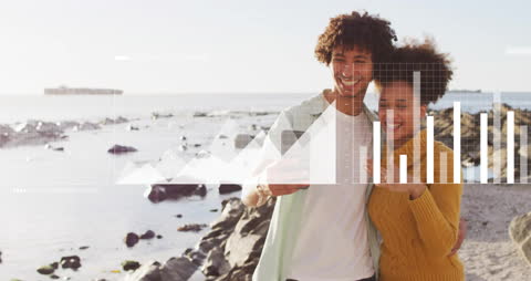 Couple Enjoying Beach With Digital Data Overlay