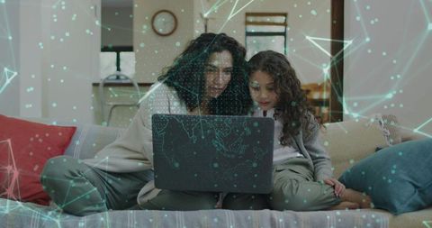 Mother and Daughter Exploring Online Learning Together on Laptop with Network Overlay