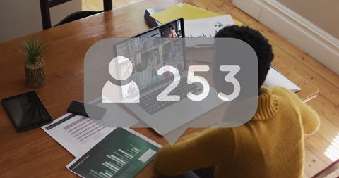 Businesswoman Engaging in Virtual Meeting with Social Media Overlay