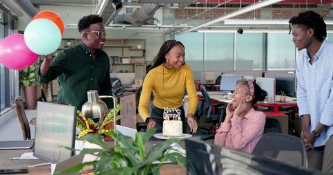 Diverse Colleagues Celebrating Birthday with Cake and Balloons