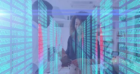 Team collaborating with holographic data streams and touchscreen device in office