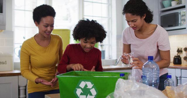 Family actively engaging in recycling activities in a home kitchen. Promoting sustainable living and environmental awareness. Ideal for topics on eco-friendly practices, education, and family teamwork.