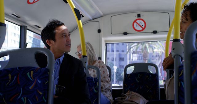 Professionals Having a Conversation on Public Bus - Download Free Stock Images Pikwizard.com