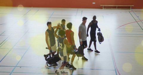 Basketball Team Showcasing Camaraderie on Indoor Court