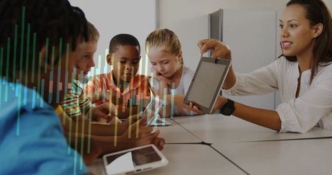 Teacher Using Tablet for Interactive Learning with Students in Classroom