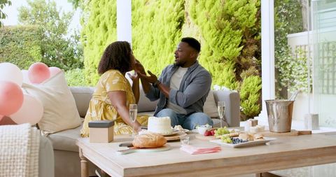 Mature Couple Enjoying Relaxing Outdoor Brunch Together