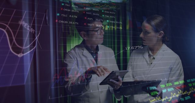 Doctors Analyzing Digital Data on a Tablet in High-Tech Setting - Download Free Stock Images Pikwizard.com