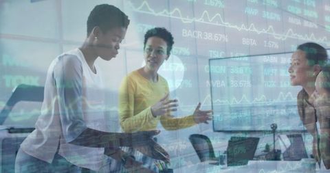 Diverse Female Coworkers Analyzing Financial Data in Office Environment