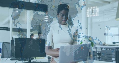 Data analyst working in modern office with global connectivity