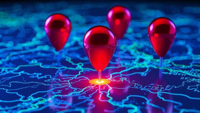 Red glossy location markers hovering over neon blue network map highlighting central target
