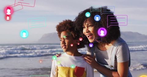 Mother and Child with Digital Communication Symbols on Beach