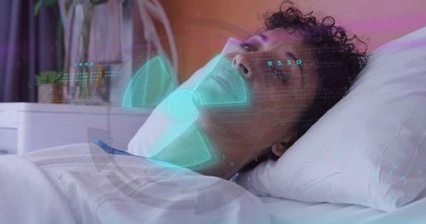 Adult woman receiving holographic health monitoring while reclining on hospital bed