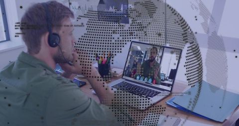 Remote team collaborating via video call, man with headset attending virtual meeting