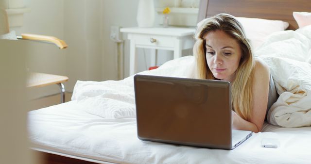 Woman Working on Laptop in Bed - Download Free Stock Images Pikwizard.com