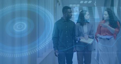 Midcareer Professionals Walking in Office Corridor Collaborating on Projects