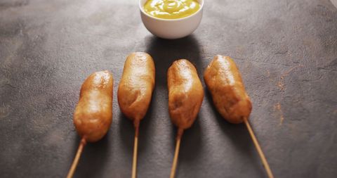 delicious corn dogs with mustard sauce on dark surface - Download Free Stock Images Pikwizard.com