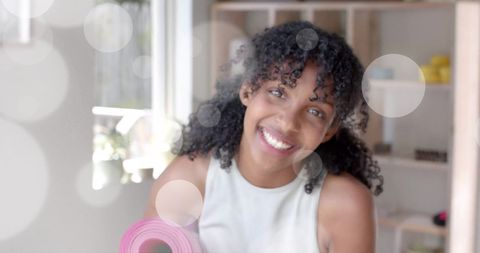 Joyful Teenage Girl Smiling Brightly Indoors with Bokeh