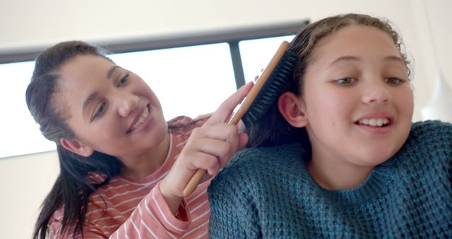 Mom Brushing Daughter's Hair at Home Family Bonding Moment - Download Free Stock Images Pikwizard.com